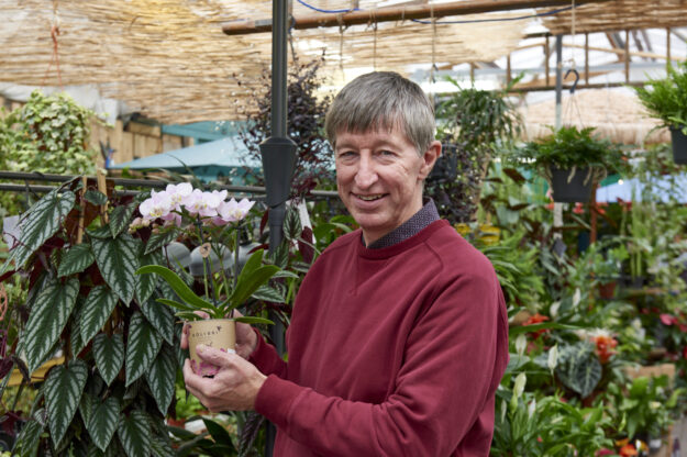 GCA CEO Peter Burks with houseplants